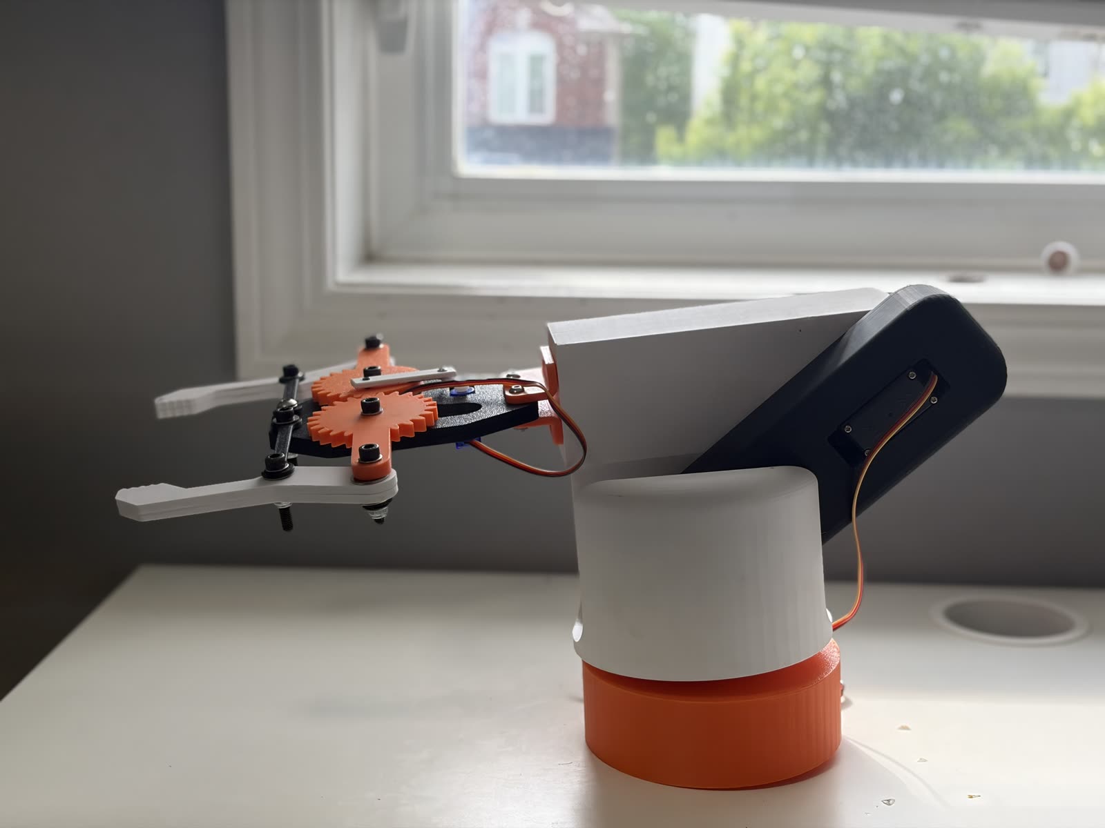 The 3D-printed robotic arm assembled on a desk