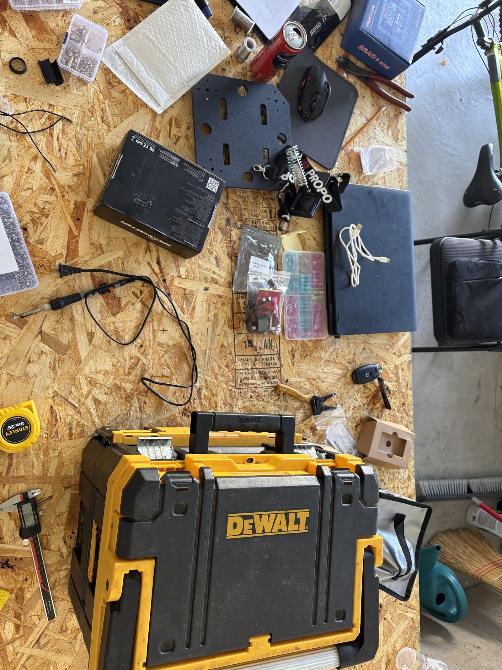 All drone components laid out on a table before assembly